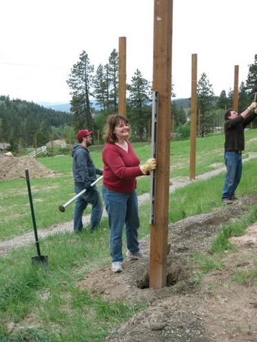 Audrey Jim Lucas volunteers youngs hill construction fence post Audrey Jim Lucas fence posts
