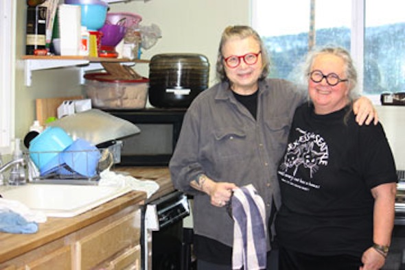 CSNW volunteers Margaret and Karen in the kitchen
